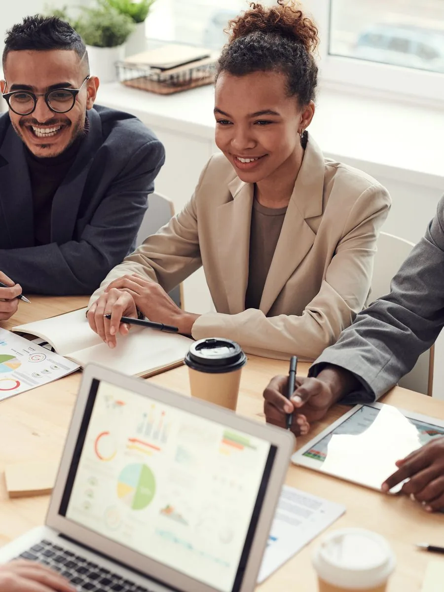 A creative team reviewing work together at a table
